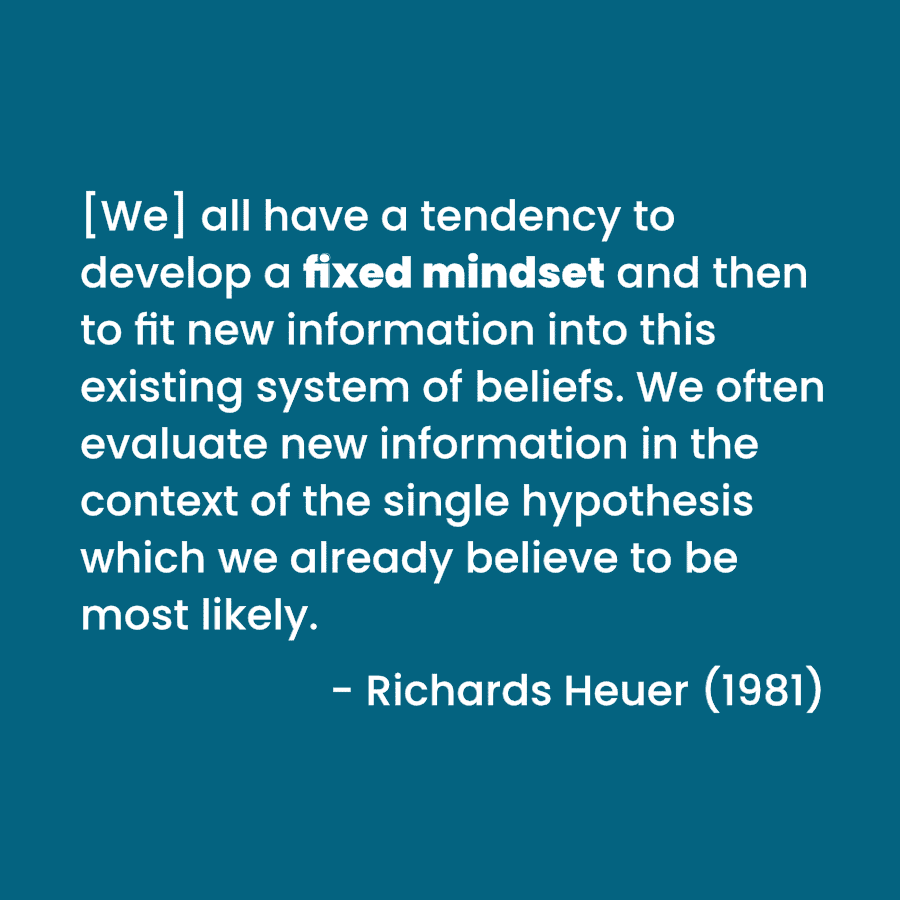 A quote on a muted blue background featuring what may be the original definition of a fixed mindset by Richards Heuer.