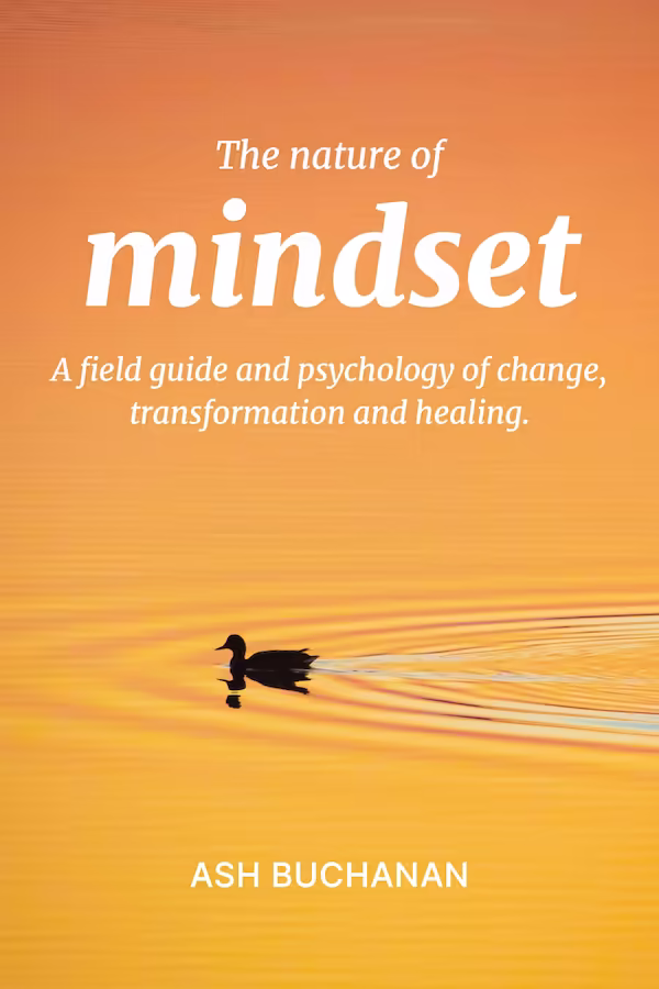 Book cover for The Nature of Mindset by Ash Buchanan, showing a duck swimming across an orange sunset lake